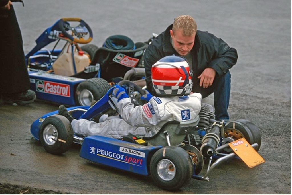 Jan Magnasson gives some advice to his young son Kevin some years ago which led to Kevin racing this season in Formula 1 grand prix racing with Team HAAS. (Peter Nygaard Grand Prix Photo)