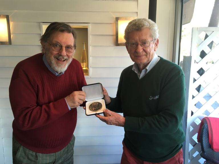 Graham Gauld, right, hands over the medal to Club Secretary, Theo Huschek