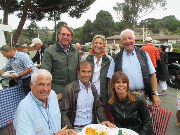 Yves Morizot, Emanuele Pirro and Marlene Pirro sitting and John Hugenholtz and his wife with Howden Ganley