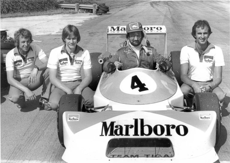 GPDC Vice-President Tim Schenken, right with team mate Stefan Johanssen (second from the left) and…….proudly sitting in the Tiga is Eddie Jordan